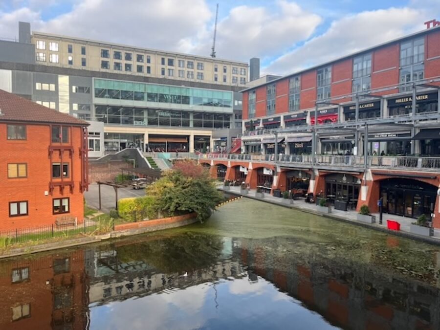 A Birmingham canal basin lined with red brick warehouses